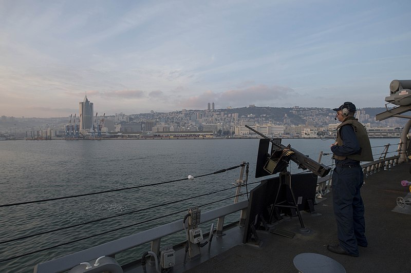 File:U.S. Navy Fire Controlman 2nd Class Raymond Slaton mans a .50-caliber machine gun aboard the guided missile destroyer USS Stout (DDG 55) as the ship pulls into port in Haifa, Israel, Jan. 19, 2014, for 140119-N-UD469-343.jpg