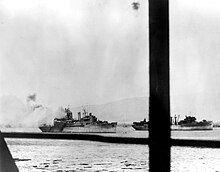 Curtiss burning at Pearl Harbor, 7 December 1941. USS Curtiss (AV-4) and USS Medusa (AR-1) during the Pearl Harbor attack, 7 December 1941 (NH 96660).jpg