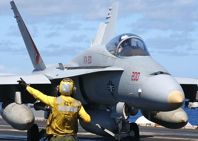 File:US Navy 030124-N-9563N-506 Flight deck personnel direct an F-A-18 Hornet after landing.jpg