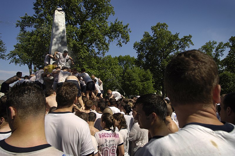 File:US Navy 060518-N-6967M-556 Nearly 1,000 freshmen midshipmen attempt to climb a 21-foot lard-covered obelisk as thousands of spectators watch with the hopes that they complete the task quickly.jpg