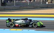 Guerrieri driving at the 2023 24 Hours of Le Mans. Vanwall Vandervell 680 - Tom Dillman, Esteban Guerrieri & Tristan Vautier enters Tertre Rouge at the 2023 Le Mans (53469021272).jpg