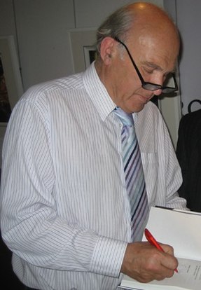 Cable autographing a copy of his book, The Storm