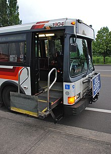 A wheelchair lift in the front door of a TriMet bus in Portland, Oregon, in 2010 1992 Flxible Metro bus with wheelchair lift fully raised.jpg