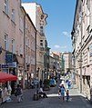 * Nomination Armii Krajowej Street in Kłodzko --Jacek Halicki 08:16, 13 July 2015 (UTC) * Promotion It is generally quiet difficult to make a good photo from a narrow shopping street, but you have used a high ISO500 and a high f-value. I only don't like the green bulding sites --Michielverbeek 21:13, 13 July 2015 (UTC)