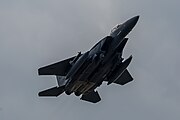 An F-15E Strike Eagle, tail number 97-0218, taking off from RAF Lakenheath in England. The aircraft is assigned to the 492nd Fighter Squadron.