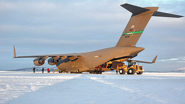 C-17 Globemaster III from the 446th and 62nd Airlift Wings loading cargo at McMurdo Station, Antarctica during Operation Deep Freeze