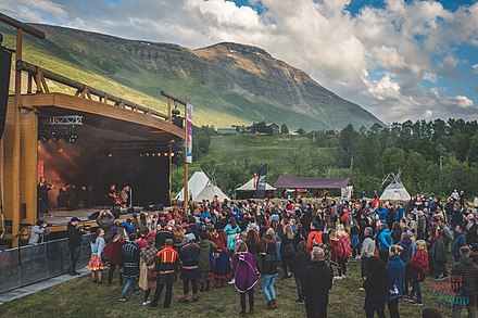 Scene from the Sami Riddu Riđđu festival. Fell landscape in the background.