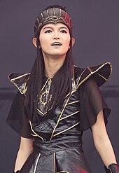 On behalf of Babymetal, Su-metal sung as a featured vocalist on the critically acclaimed "Kingslayer" from Post Human: Survival Horror Babymetal - 2018152162519 2018-06-01 Rock am Ring - 1D X MK II - 0584 - AK8I2453 (cropped).jpg