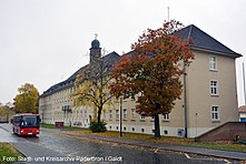 A photograph of the HQ building in Barker Barracks Paderborn c2016. To the right of the building is the memorial wall of 35 Engineer Regiment.