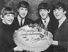 The Beatles had their first number one single with "She Loves You" in November 1963. Beatles Trenter 1963.jpg