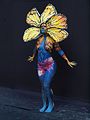 Blue body painted woman with yellow petals at WBF 2016.jpg