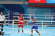 Deutsch: Boxen bei den Olympischen Jugendspielen 2018 Tag 12, 18. Oktober 2018 - Finale Leichtgewicht Mädchen – Junioren-Weltmeisterin und dreifache Juniorinnen-Europameisterin Caroline Sara DuBois (Großbritannien, blau) schlägt Juniorinnen-Asienmeisterin Porntip Buapa (Thailand, rot). English: Boxing at the 2018 Summer Youth Olympics on 18 October 2018 – Girls' lightweight Gold Medal Bout – Caroline Sara DuBois (Grat Britain, blue) wins over Porntip Buapa (Thailand, red). Español: Boxeo en los Juegos Olímpicos Juveniles de Verano de 2018 en 18 de octubre de 2018 - Combate de medalla de oro de peso ligero para niñas - Caroline Sara DuBois (Gran Bretaña, azul ) gana sobre Porntip Buapa (Tailandia, rojo).