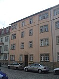 Group of houses with an L-shaped floor plan