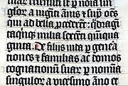 Calligraphy in a Latin Bible of 1407 on display in Malmesbury Abbey, England. This Bible was hand-written in Belgium, by Gerard Brils, for reading aloud in a monastery.