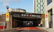 Railway bridge over Penarth Road, Cardiff: one of several painted with Brains advertising slogans Cardiff PenarthRd bridge.jpg