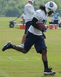 Arizona Cardinals' running back Chris Johnson (C) is surrounded by