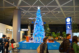 Christmas trees are displayed at the terminal of Tokyo Narita Airport in this year(2014).