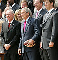 Tom Coughlin ,George W. Bush and Eli Manning.