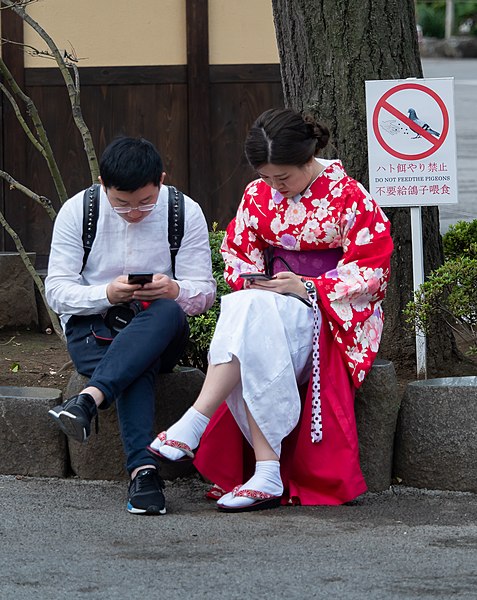 File:Couple with mobile phones at Senso-ji (cropped).jpg