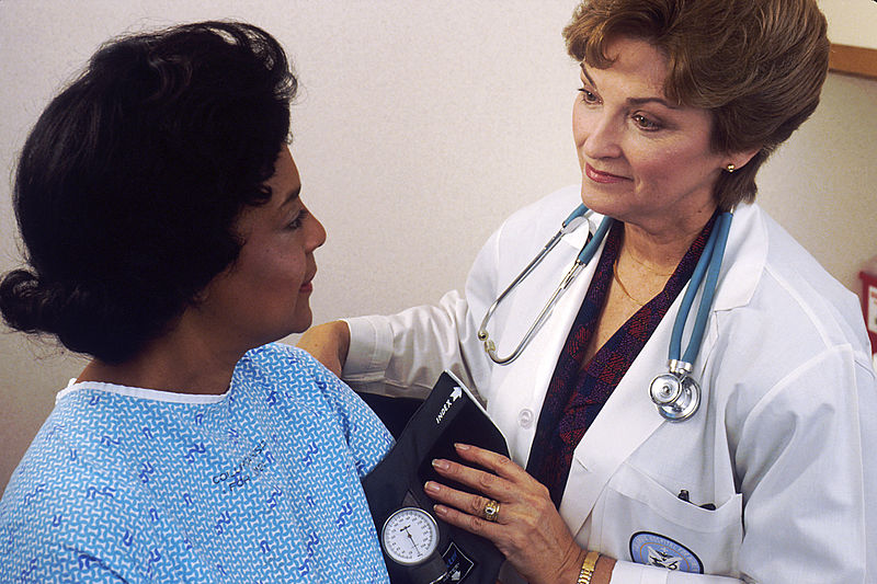 File:Doctor takes blood pressure.jpg