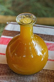 A berele glass containing tej, a honey wine brewed and consumed in Ethiopia. ET Amhara asv2018-02 img077 Lake Tana at Bahir Dar.jpg