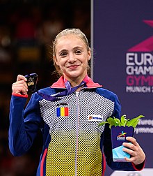 European Championships 2022-08-14 Junior Women Apparatus finals Victory ceremony (Norman Seibert) - DSC 0530 (cropped).jpg