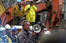 President Bush, beside firefighter Bob Beckwith, addressing rescue workers at the World Trade Center site FEMA - 3905 - Photograph by SFC Thomas R. Roberts taken on 09-14-2001 in New York.jpg