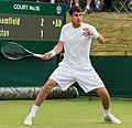 Farrukh Dustov competing in the first round of the 2015 Wimbledon Qualifying Tournament at the Bank of England Sports Grounds in Roehampton, England. The winners of three rounds of competition qualify for the main draw of Wimbledon the following week.