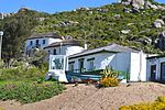 These oval-shaped cottages were built by George Goode Busch in 1918 and are the only remaining fishermen’s cottages of this type in the vicinity of Saldanha. These oval-shaped cottages were built by George Goode Busch in 1918 and are the only remaining fishermen's cottages of this type in the vicinity of Saldanha.