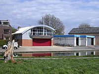 The college's boathouse on the River Cam, with the Fitzbilly mascot in the foreground Fitzwilliam College new Boat House - geograph.org.uk - 759539.jpg