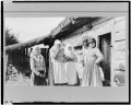 Five peasant women standing outside of log house, Russia LCCN97517362.tif