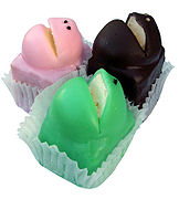 Three frog cakes, in green, pink and brown varieties.