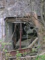 The remains of the waterwheel inside the mill extension
