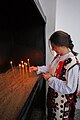 Girl lighting a candle