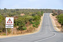 A sign warning of carjacking activities along a stretch of road in Gauteng, South Africa Hijacking Hotspot, R511 in Gauteng (South Africa).jpg