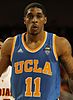 Jones wearing blue basketball jersey with text "UCLA 11" in yellow