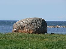 Glacial erratic Ehalkivi with overground volume 930 cubic metres (1,220 cu yd) (weight approximately 2,500 metric tons or 2,800 short tons) in Estonia Letipea hiidrahn.jpg
