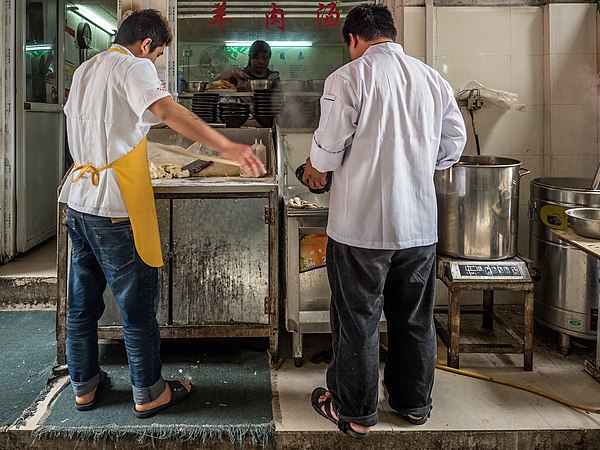 Two men making noodles in Shanghai