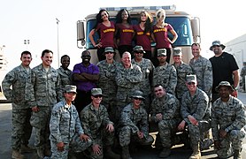 Football players Marco Rivera, R.W. McQuarters and cheerleaders