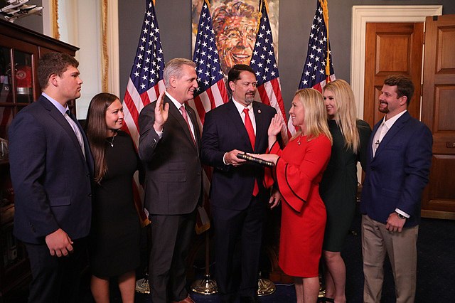 Greene being sworn in by Minority Leader Kevin McCarthy