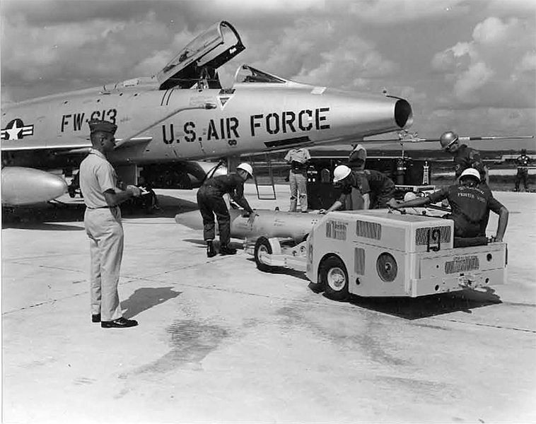 File:Mark-28 bomb being transported to an F-100 via bomb lift truck by the load crew of the 18th Tactical Fighter Wing at Kadena Air Base.jpg