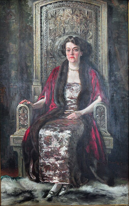 Alma de Bretteville Spreckels painted in 1924 by artist Richard Hall. In the painting, Spreckels sits in a chair originally designed (and at least par