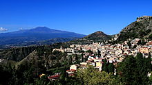Mt Etna and Taormina as seen from the Ancient Theatre of Taormina (22290641726).jpg