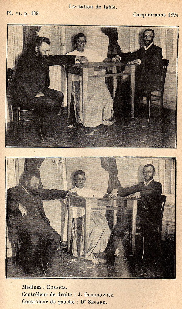 Palladino, 1894; Julian Ochorowicz (left) controls right hand; Dr. Ségard controls left hand and feet.