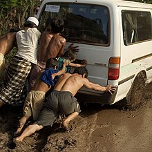 6 people pushing a van Pushing van together (cropped).jpg