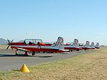 Line-up of Pilatus PC-9As of the Royal Australian Air Force Roulettes aerobatics team. All of CFS's aircraft are painted in these colours.