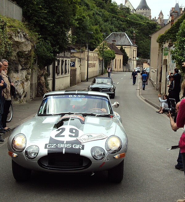 Road rally passing through an urban setting