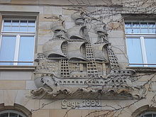 A ship symbolising foreign trade on the outside of a colonial goods shop in Gotha (founded 1893) Relief Handelshaus Gotha.JPG