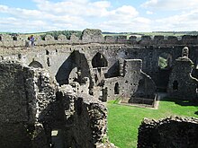 Looking across the courtyard of Restormel Castle. Opposite, a modern timber staircase leads to the chapel. Restormel Castle 2018 3.jpg