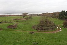 Sandscale No1 pit. A large sandstone winding engine bed can be seen behind the trees. A brick winding engine bed is to the left and the cooling pond behind. RoanheadSandscale 001.jpg